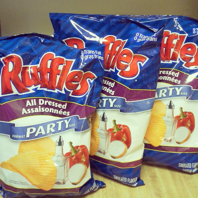 3 packages of ruffles all dressed party chips on a counter
