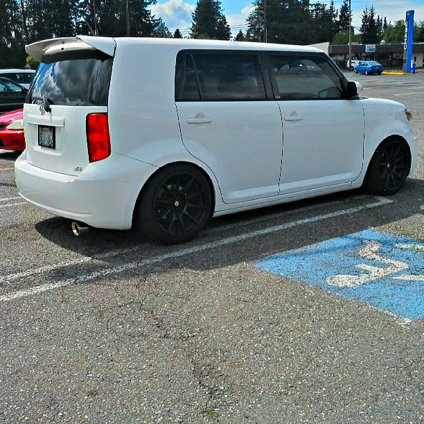 an empty white van in a parking lot