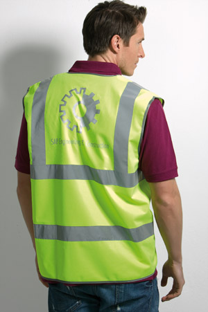 a man wearing a bright green reflective vest