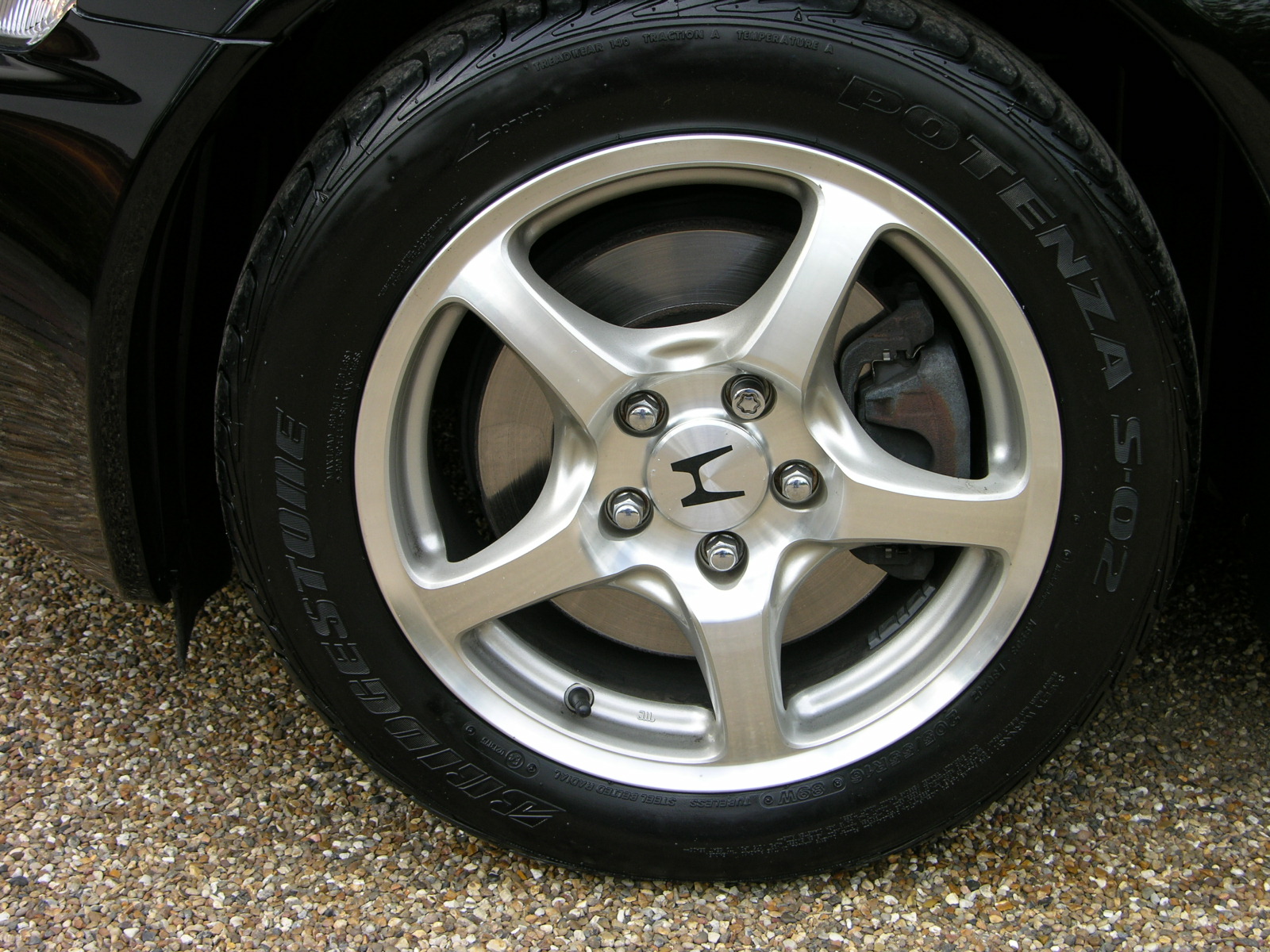 a close up view of the wheel and tire of a car