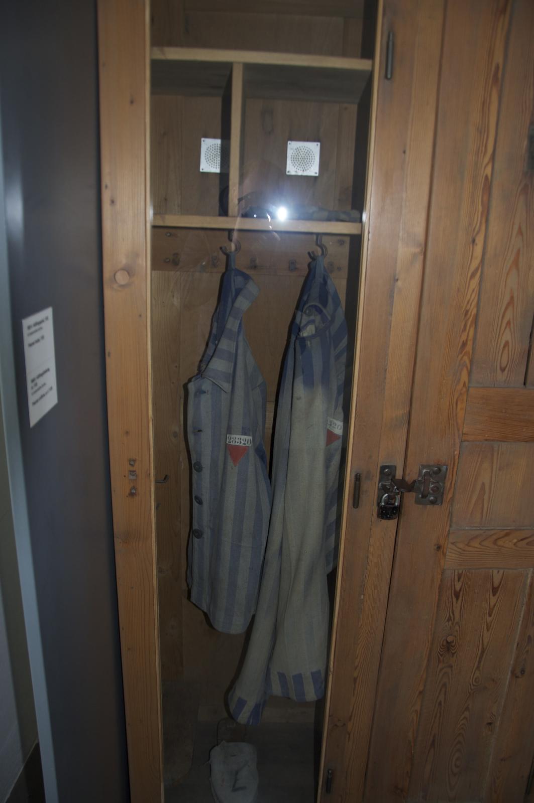 two towels that are in a wooden wardrobe