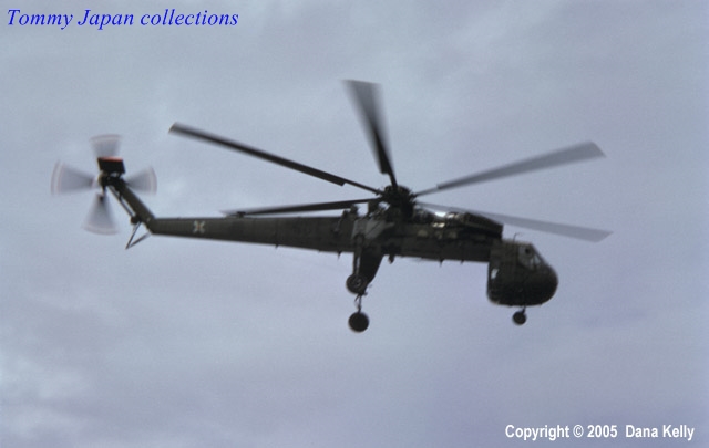 a helicopter flying through the air with four rotors