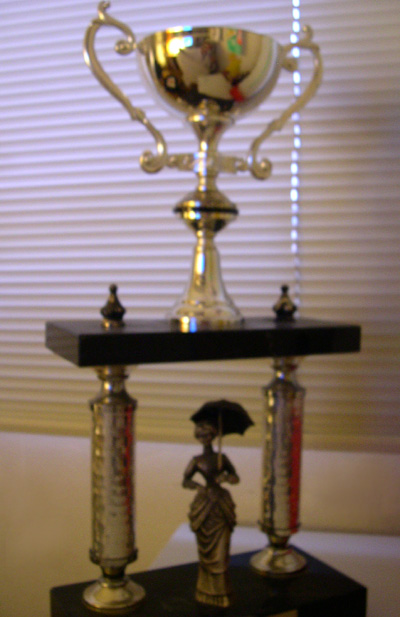 a trophy sitting on top of a wooden table
