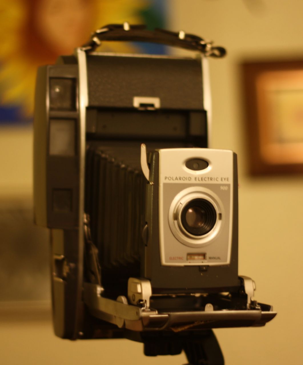 an antique camera on top of a tripod