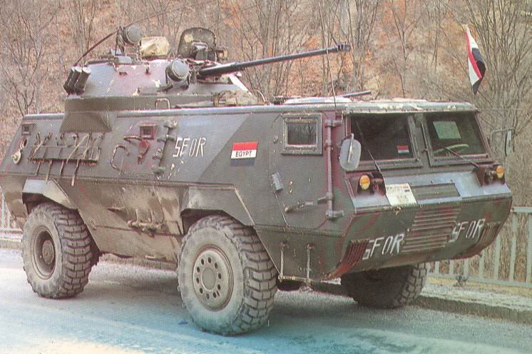 an armored vehicle moving down the road