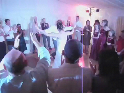 a blurry po of people in a party dance