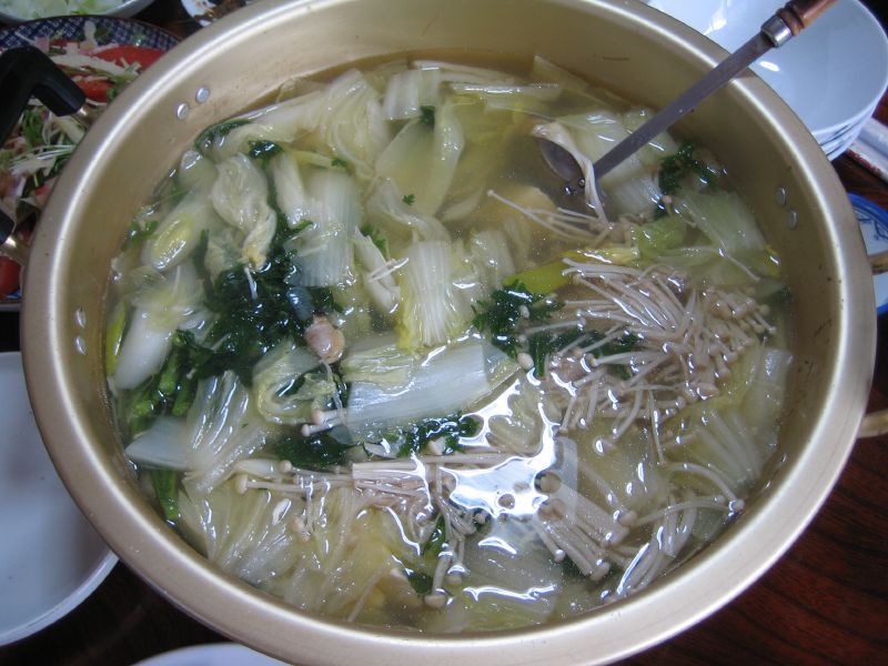 a bowl of soup sits on a table