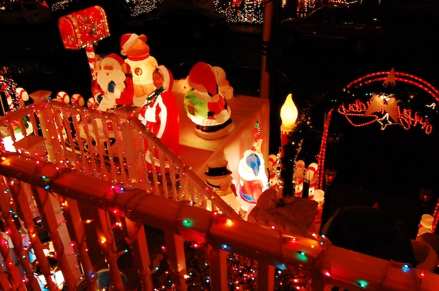 a christmas display features animated santa claus, lights and decorations