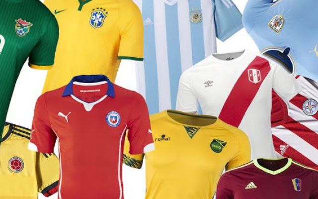 several colors of soccer jerseys and hats are in this image