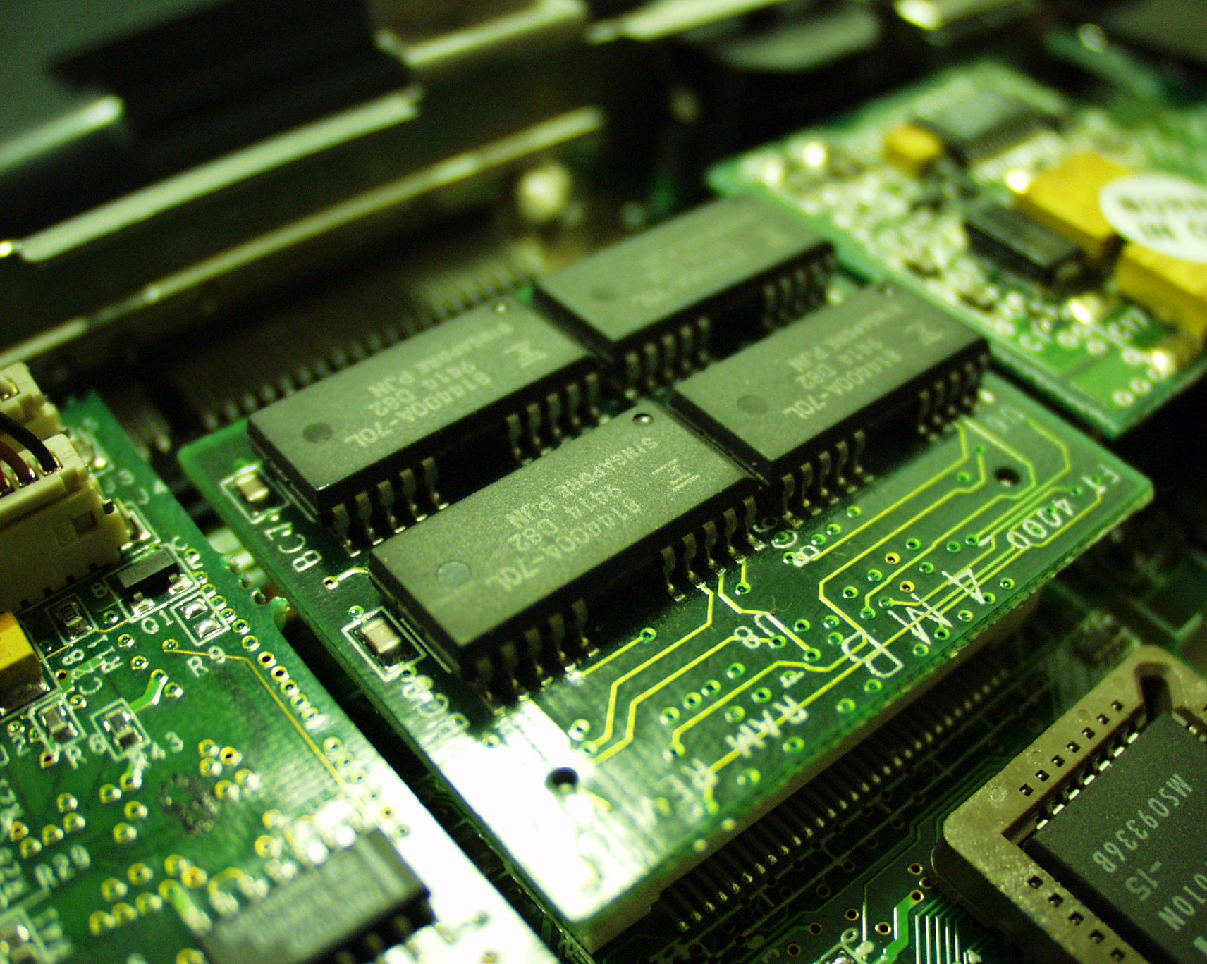 a close up image of many components on top of a computer board