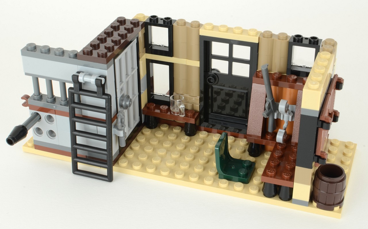 a building made out of lego bricks with some furniture and accessories