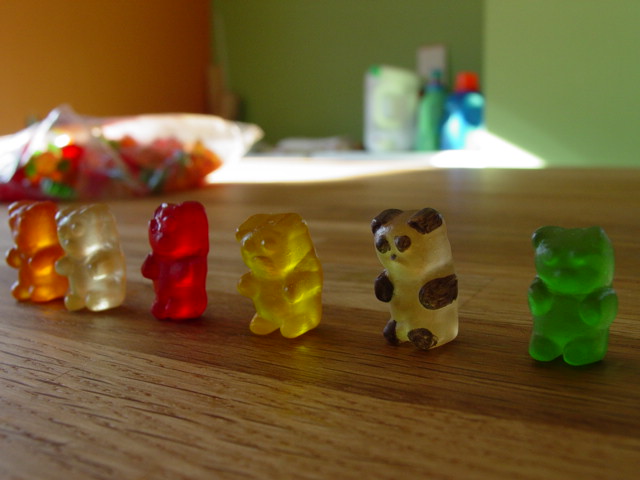 small gummy bears on a wooden table