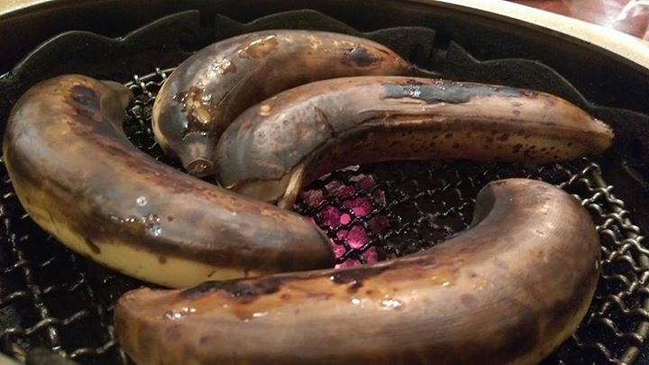 bananas on a grill cooking with brown wax