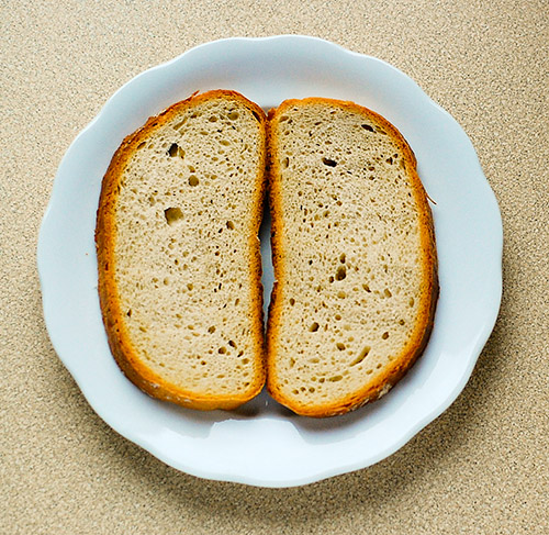 two pieces of bread are on a white plate