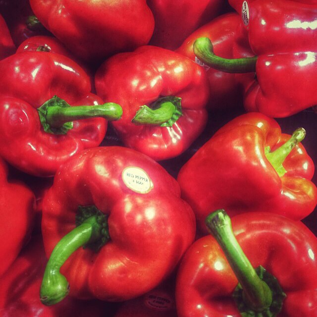 there are several red peppers that are ready to be cooked