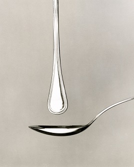 the spoon is being suspended in the sky