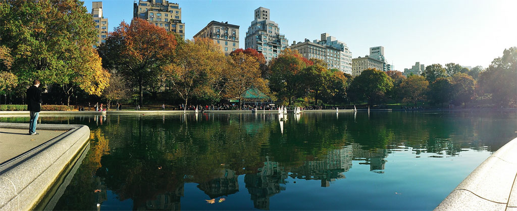 a view of the river and skyline, with people walking