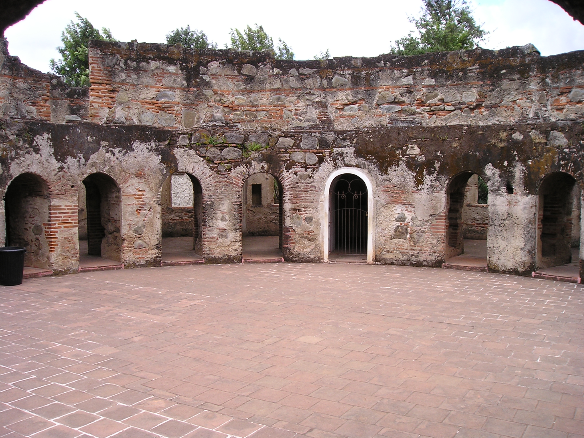 a stone building has many doorways and arches