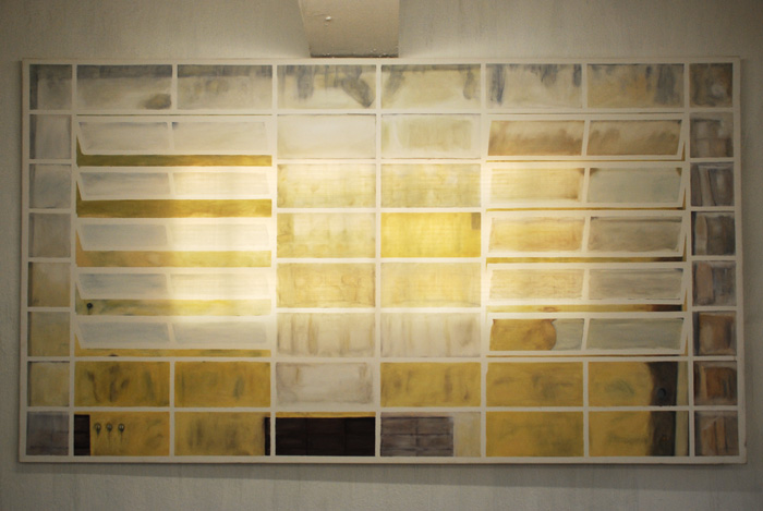 yellow and brown squares on display in a room