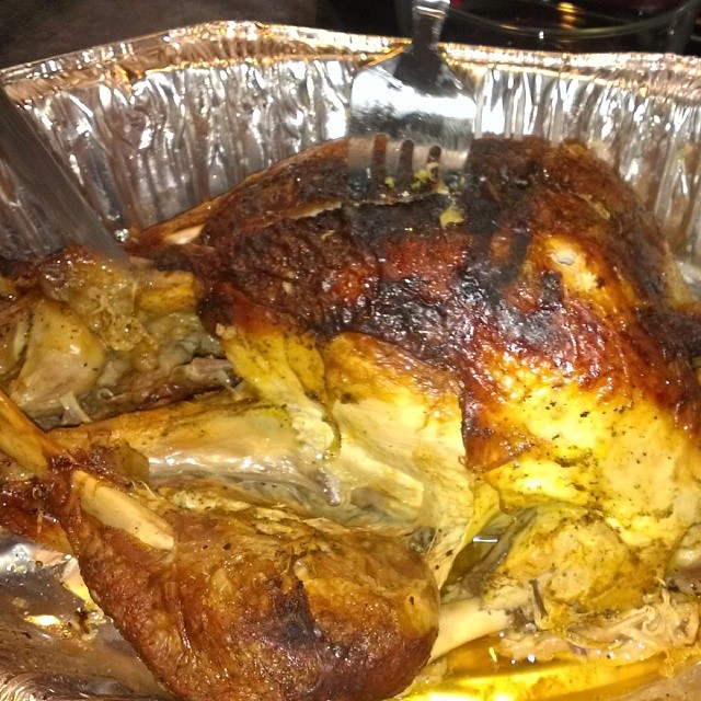 the roasting chicken is in tin foil and ready to be cooked