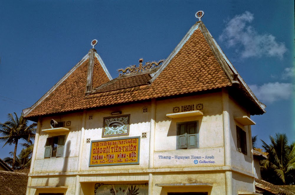an older style building with a very large roof