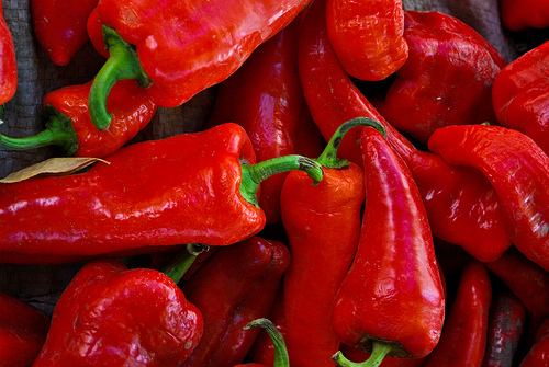 a pile of  peppers are piled together