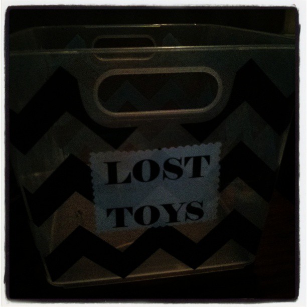 an extra small chevron storage bin with the lost toys tag on it