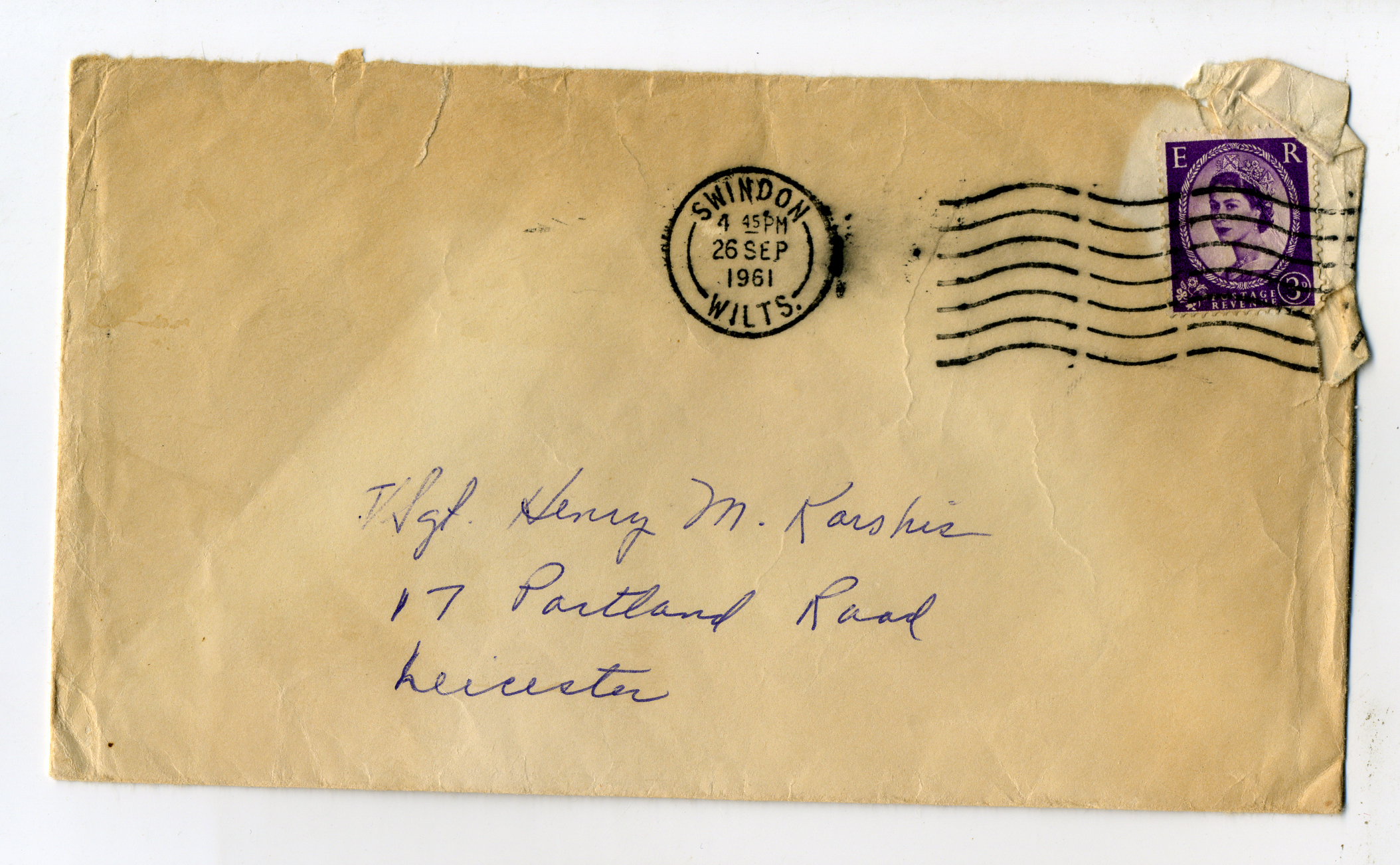 an old envelope with a letter and postage