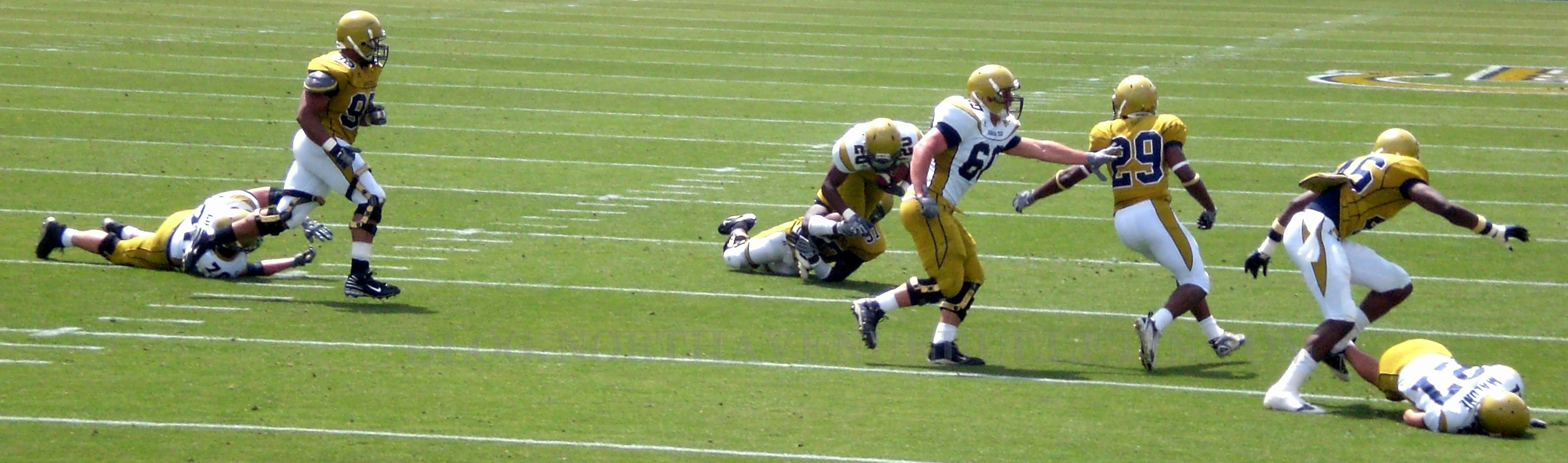 players running with football in their hands on the field