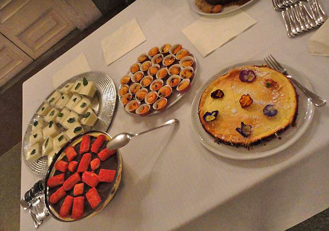 several pastries and deserts sit on a table