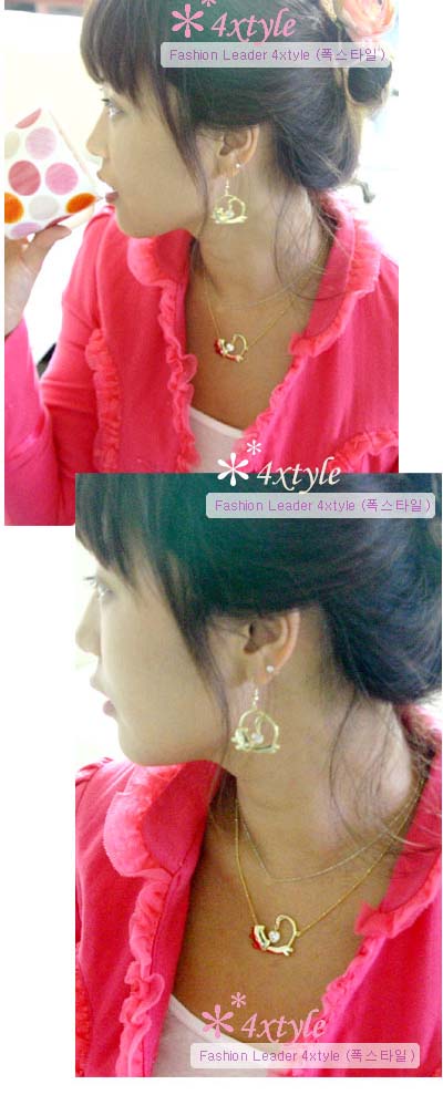 a girl with earrings and pink shirt