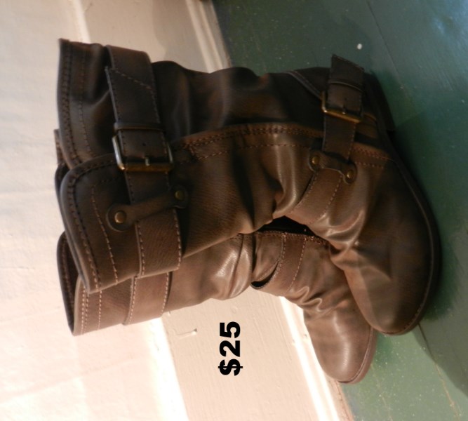 a pair of brown boots that are on the ground