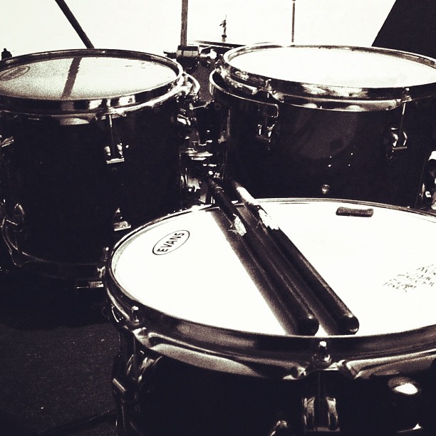 two drum heads that are facing towards each other