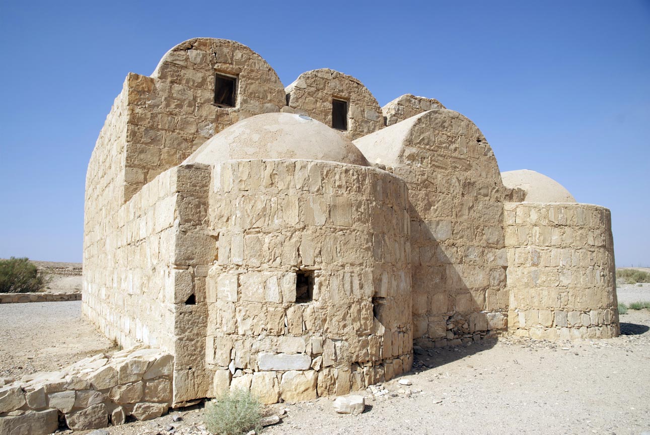 a large stone structure in the middle of the desert