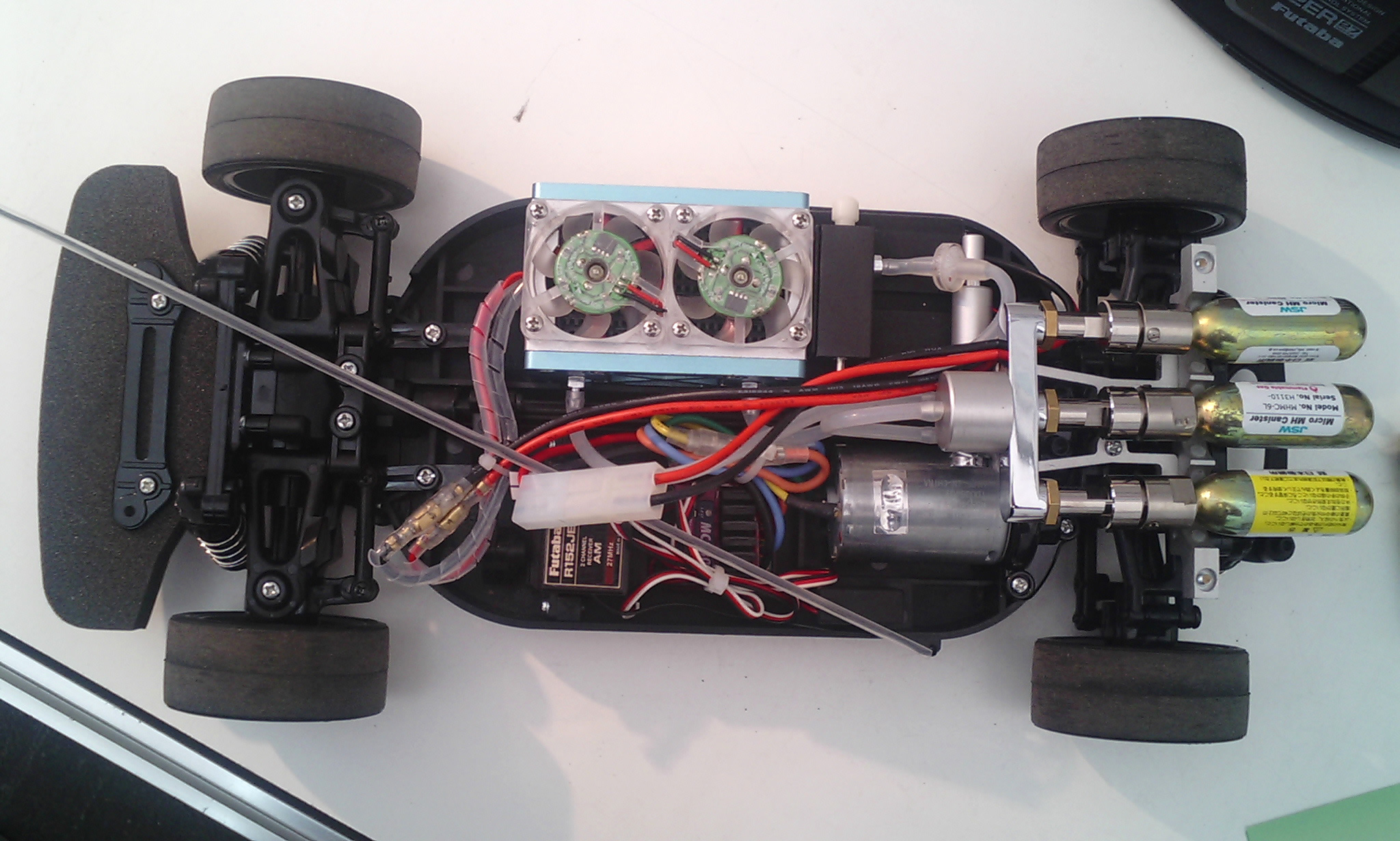 a toy car with various electronics and wires attached
