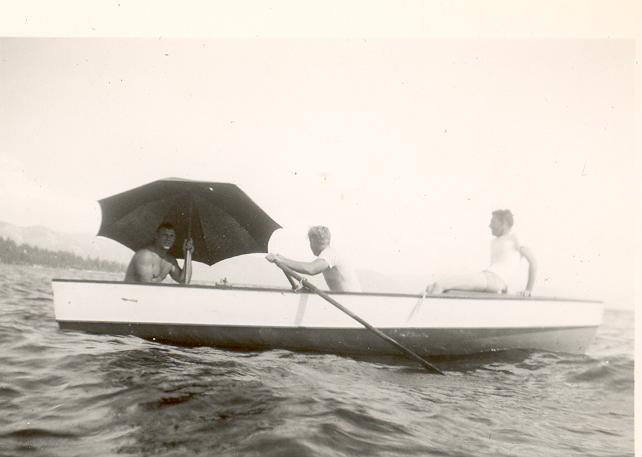 an old po of a group of people riding on top of a boat