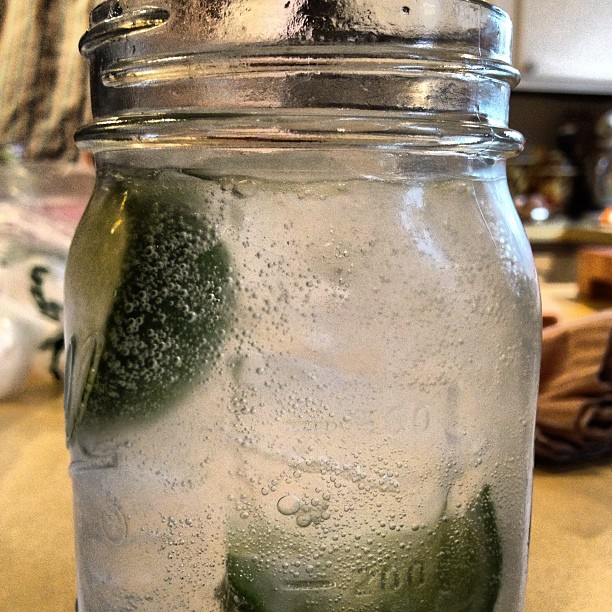 a glass jar with a slice of broccoli inside