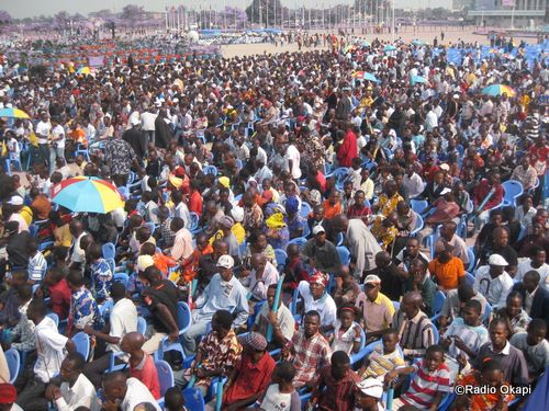 a large crowd of people on a beach