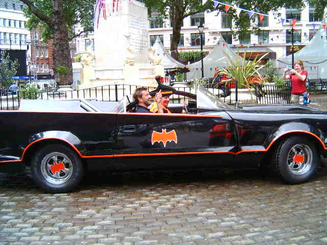 a car is decorated with orange and black stripes