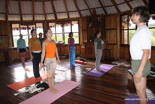 a yoga class is practicing on the floor