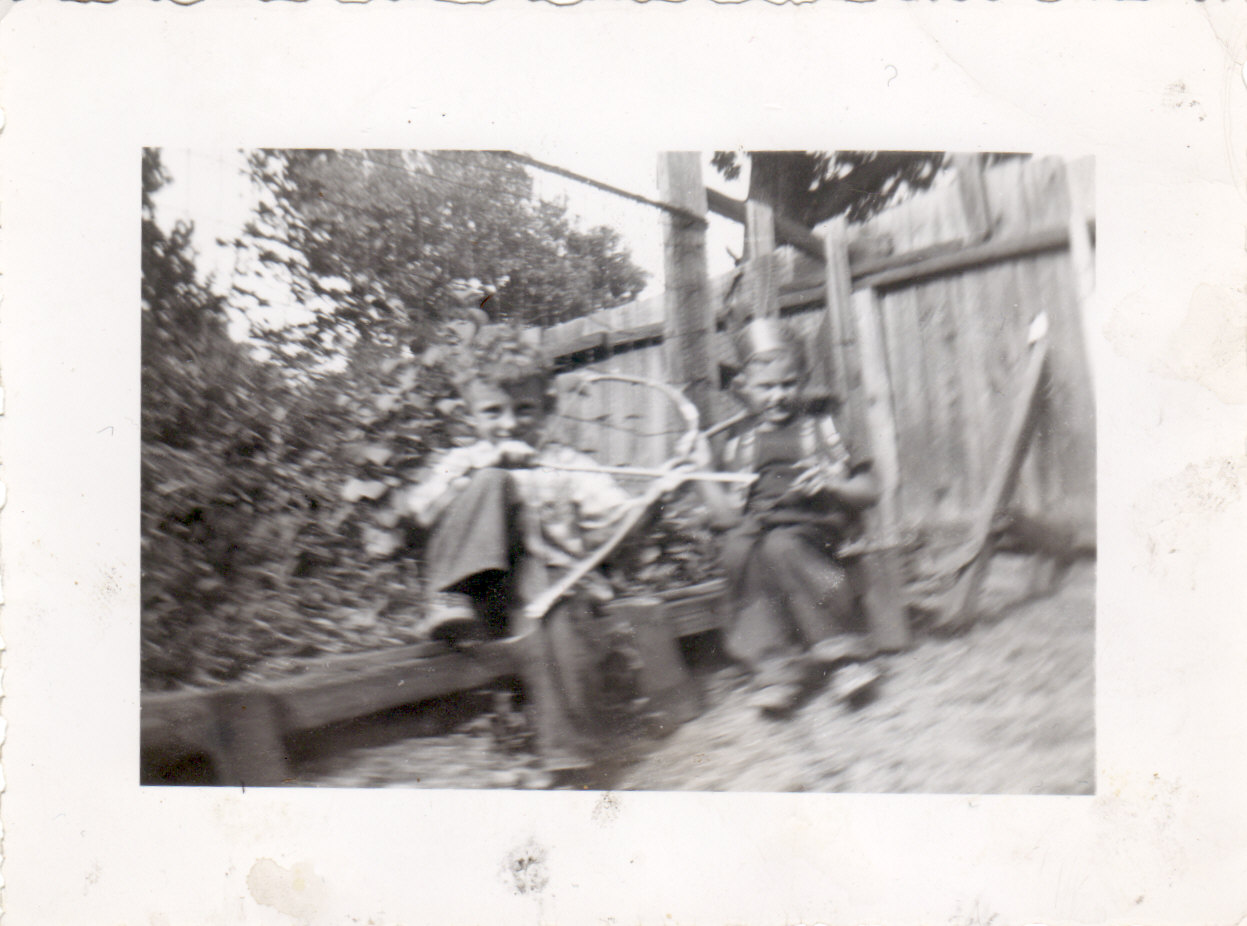 an old black and white po of people in the outdoors