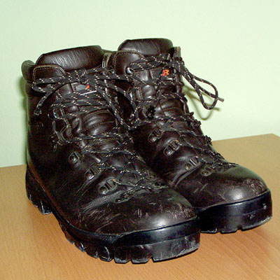 a pair of black boots sit on a table