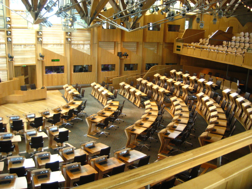 the view from an audience's seat in a lecture hall