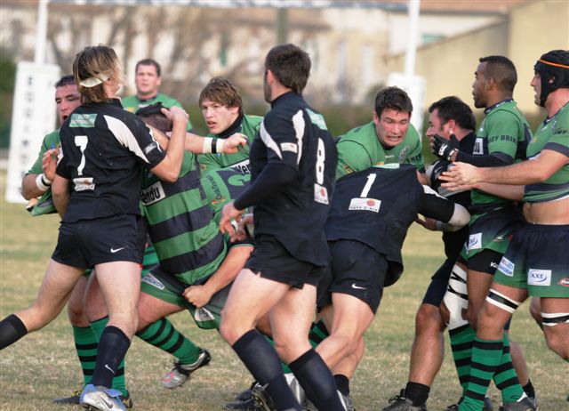 a group of rugby players on the field during a game