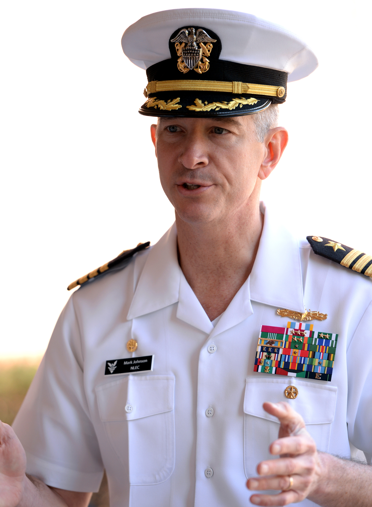 a man in a naval uniform is talking
