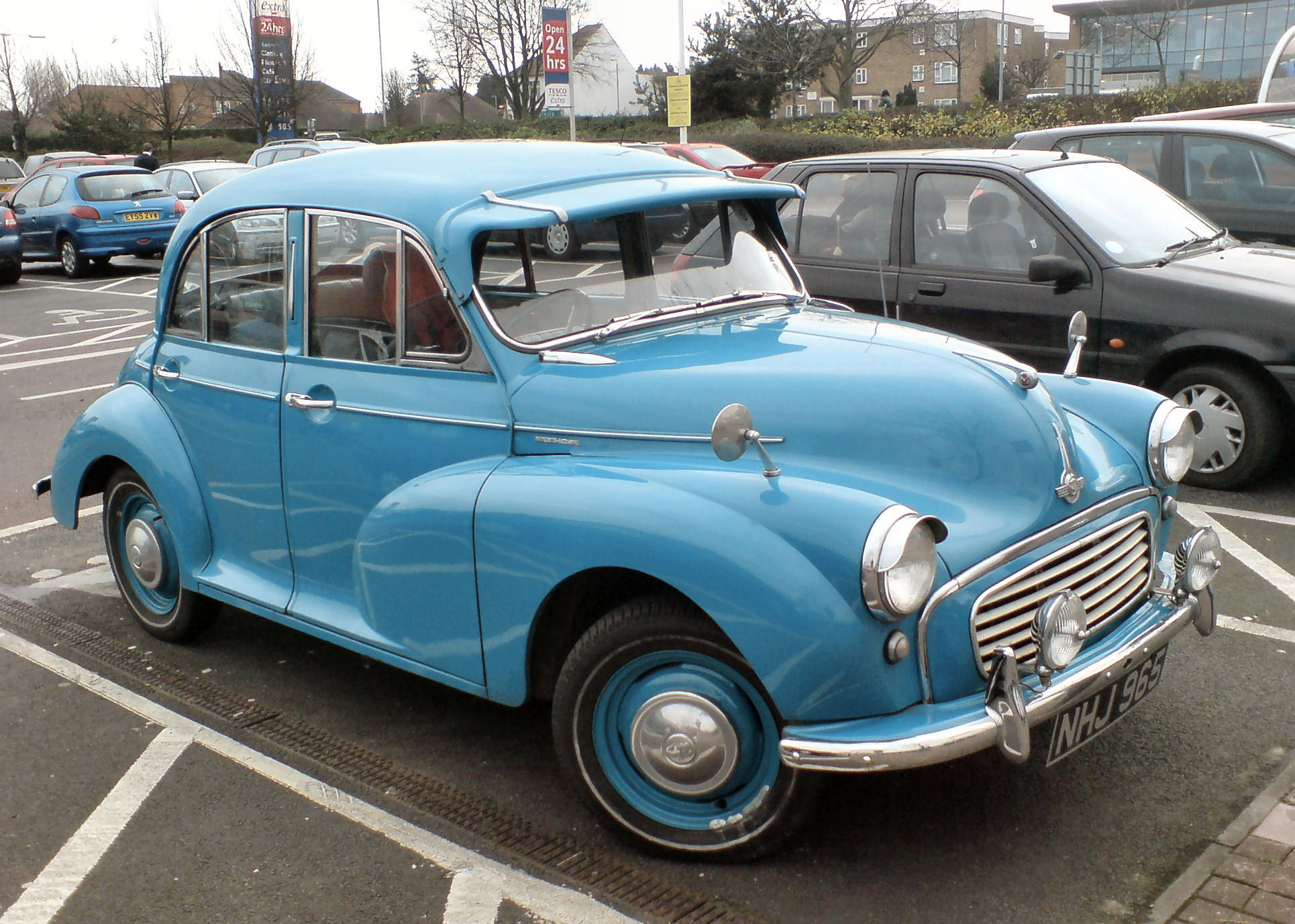 the older car has an open hood