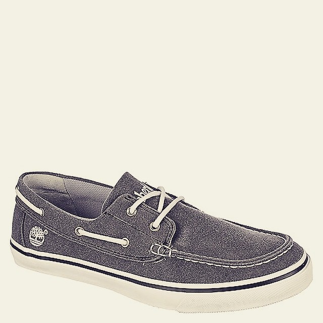 a man's blue and white boat shoes