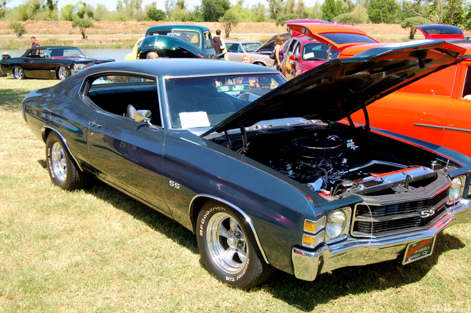 the hood up and top of an older car