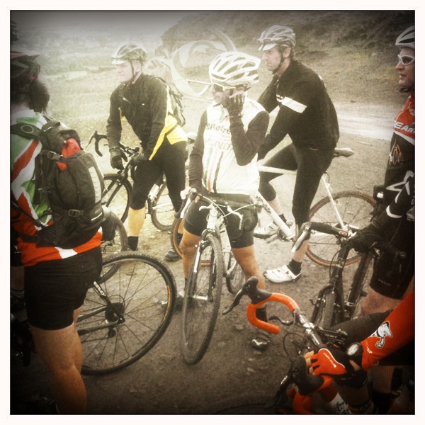 several people on bicycles with helmets on their heads