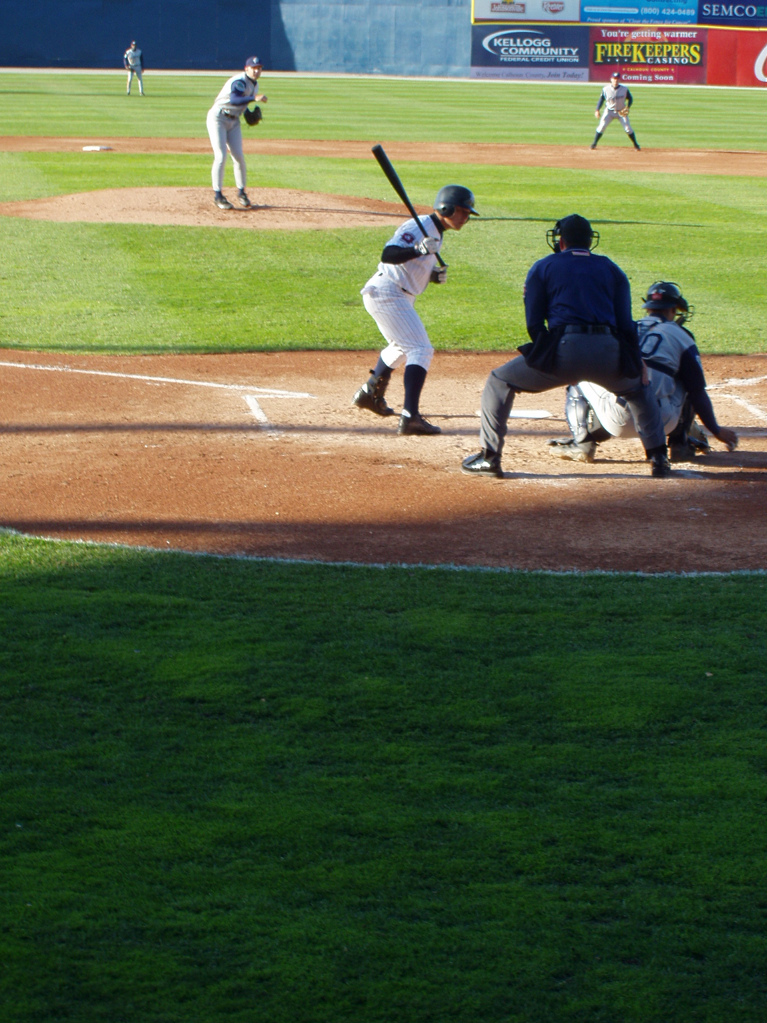 a baseball game in progress with the batter up to plate